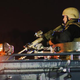 Police confront demonstrators during a protest Aug. 15, 2014, in Ferguson, Mo., over the shooting death of Michael Williams. Police shot pepper spray, smoke, gas and flash grenades at protesters before retreating. County police sat nearby with armored personnel carriers.
Scott Olson/Getty Images